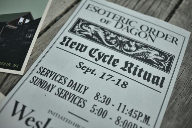 closeup up of the pamphlet from the esoteric order of dagon advertising a new cycle ritual and daily services with a nice fish banner