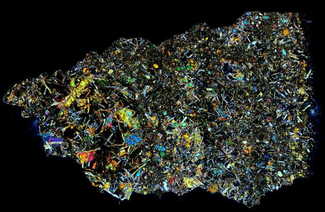 Thin Section of the Pasamonte Meteorite in Cross Polarized Light.

Solar Anamnesis, CC BY-NC-ND 2.0 via Flickr: https://flic.kr/p/NRkA4U