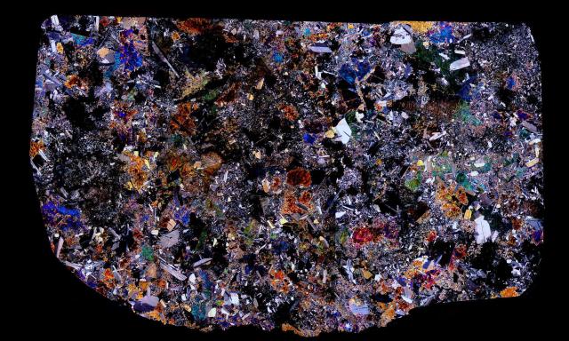 Thin Section of the Juvinas Meteorite in Cross Polarized Light.

Solar Anamnesis, CC BY-NC-ND 2.0 via Flickr: https://flic.kr/p/P2Cvfp