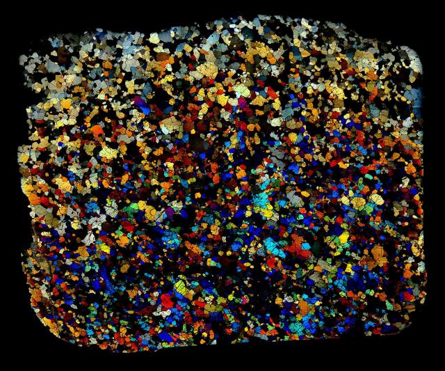 Northwest Africa (NWA) 5400 Meteorite Thin Section in Cross Polarized Light.

Solar Anamnesis, CC BY-NC-ND 2.0 via Flickr: https://flic.kr/p/NTPeWa