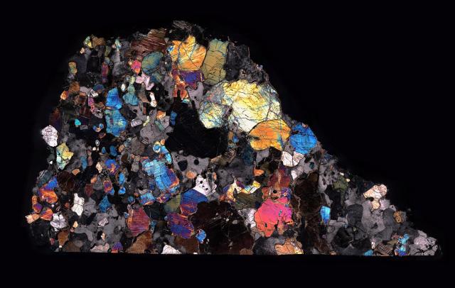 Northwest Africa (NWA) 7325 Meteorite Thin Section in Cross Polarized Light.

Solar Anamnesis, CC BY-NC-ND 2.0 via Flickr: https://flic.kr/p/RgmpqF