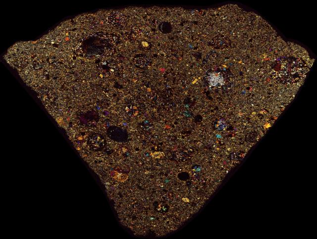 Northwest Africa (NWA) 7302 Meteorite Thin Section - XPL HDR Pathscan Enabler.

Solar Anamnesis, CC BY-NC-SA 2.0 via Flickr: https://flic.kr/p/2hWHUQ8