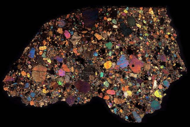 Northwest Africa (NWA) 8251 Meteorite Thin Section in Cross Polarized Light.

Solar Anamnesis, CC BY-NC-ND 2.0 via Flickr: https://flic.kr/p/SgAY8o