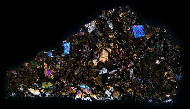 Northwest Africa (NWA) 032 Meteorite Thin Section in Cross Polarized Light.

Solar Anamnesis, CC BY-NC-ND 2.0 via Flickr: https://flic.kr/p/SSsDWJ