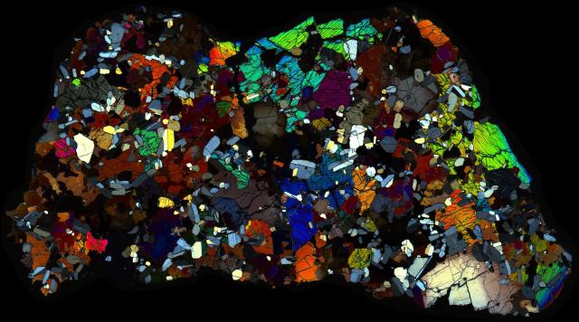 Northwest Africa (NWA) 4590 Meteorite Thin Section - XPL HDR Pathscan Enabler.

Solar Anamnesis, CC BY-NC-SA 2.0 via Flickr: https://flic.kr/p/2hrSVcf