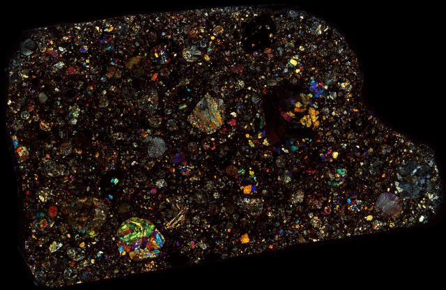 Northwest Africa (NWA) 5677 Meteorite Thin Section - XPL HDR Pathscan Enabler.

Solar Anamnesis, CC BY-NC-SA 2.0 via Flickr: https://flic.kr/p/2iaFK4v