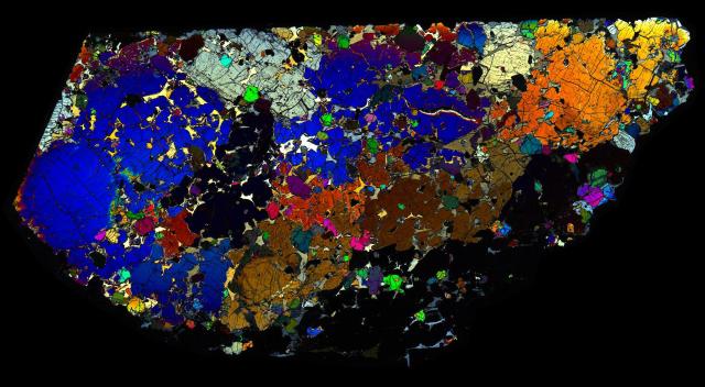 Northwest Africa (NWA) 6704 Meteorite Thin Section - XPL HDR Pathscan Enabler.

Solar Anamnesis, CC BY-NC-SA 2.0 via Flickr: https://flic.kr/p/2hRykgN