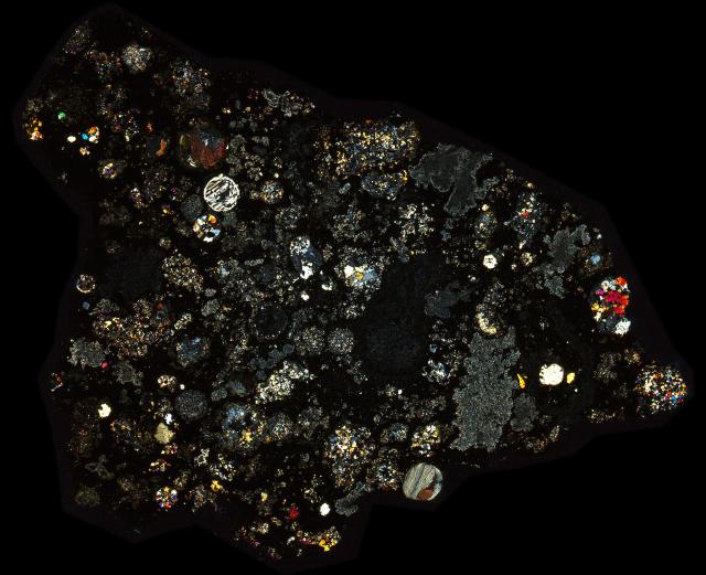 Allende Meteorite Thin Section - XPL HDR Pathscan Enabler.

Solar Anamnesis, CC BY-NC-SA 2.0 via Flickr: https://flic.kr/p/2hZoXnb