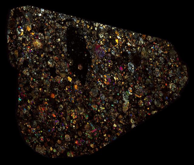 Northwest Africa (NWA) 2911 Meteorite Thin Section - XPL HDR Pathscan Enabler.

Solar Anamnesis, CC BY-NC-SA 2.0 via Flickr: https://flic.kr/p/2hUdErz