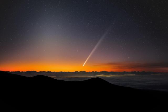 "Comet C/2023 A3 (Tsuchinshan–ATLAS) at dawn over Maunakea. The zodiacal light is seen to the left."

International Gemini Observatory/NOIRLab/NSF/AURA/M.Rodriguez, CC BY 4.0, via Wikimedia Commons.