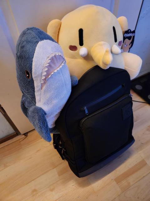 LTT backpack with BLÅHAJ and Mastodon plush sticking out of the top