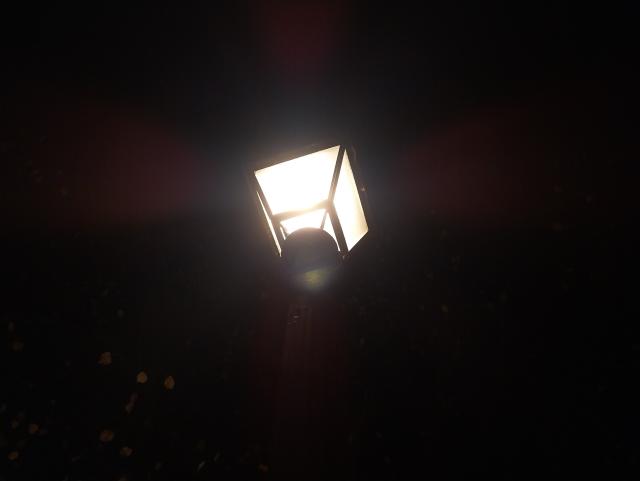 old-fashioned street light at night, seen from below 