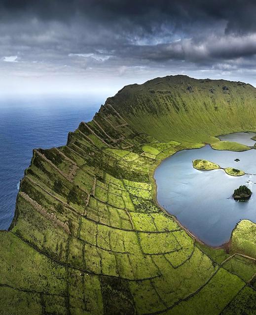 aerial photo of green land along the inner slope of Corvo Island, Azores (Portugal)