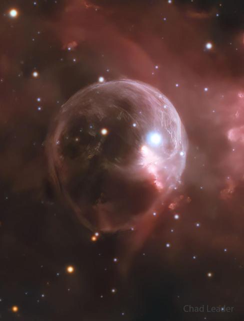 A starfield is shown with a big light bubble in the center. A bright star is toward the upper right in the translucent bubble. To some, the bubble may resemble a skull.