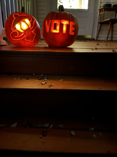 Two Jack O’Lanterns. One reads “VOTE” 