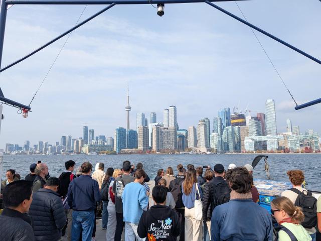 Island ferry with passengers and the skyline