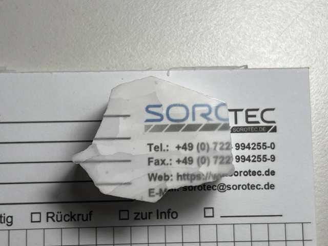 Piece laid down flat on printed paper showing a clear image of what is underneath 