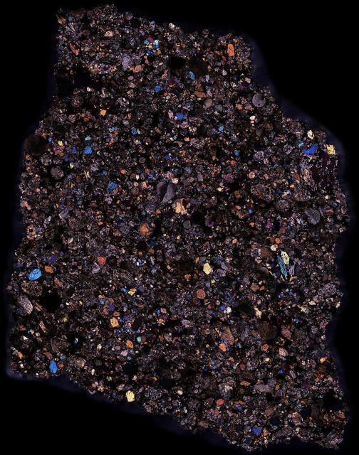 Thin Section of the Saratov Meteorite in Cross Polarized Light.

Solar Anamnesis, CC BY-NC-ND 2.0 via Flickr: https://flic.kr/p/T4vGC1