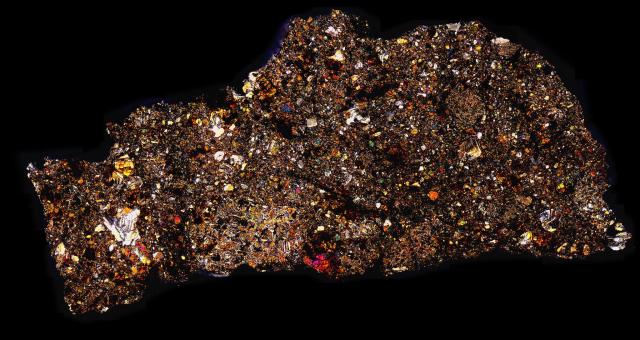 Camel Donga Meteorite Thin Section in Cross Polarized Light.

Solar Anamnesis, CC BY-NC-ND 2.0 via Flickr: https://flic.kr/p/NWFAqA