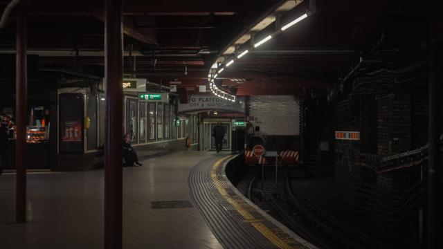 Photograph of a tube station showing people waiting for a train.