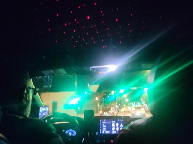Flashy view from the back of the car with stars on the ceiling