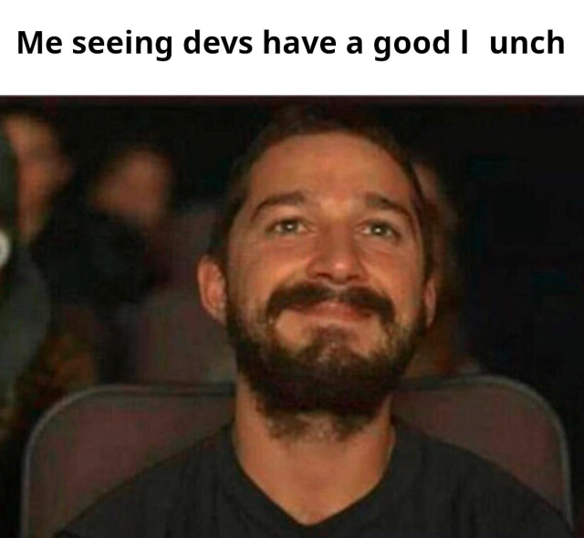 Top caption says "Me seeing devs have a good l[ ]unch"
Below is a person smiling, sitting in a movie theater.