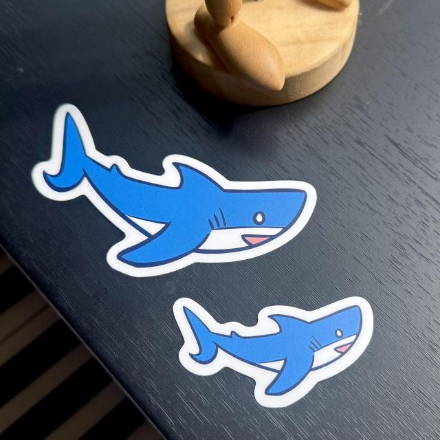 Smiling blue shark stickers in two sizes!