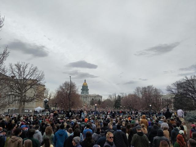 Huge crowd of people in front of the Colorado statehouse