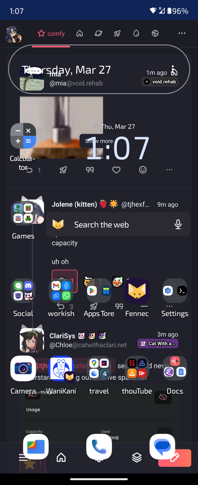mir's android home screen but instead of the background or anything it's a garbled sharkey ui. mia's gif has another post behind it which contains the current date but is otherwise indecipherable 