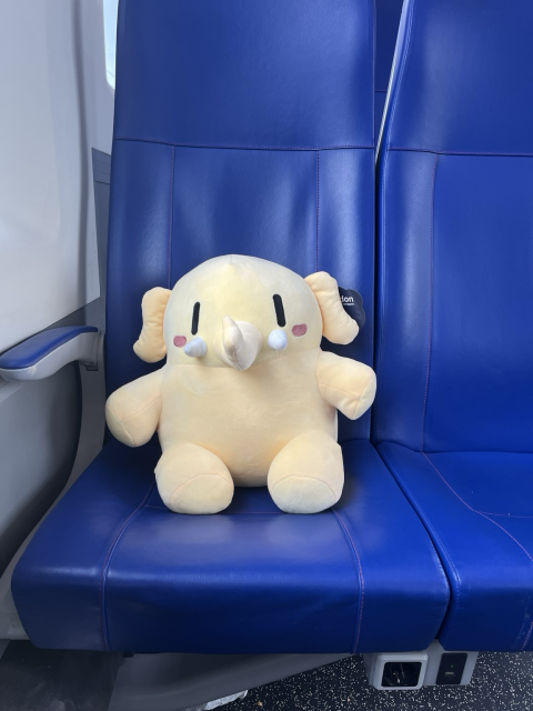 Plushtodon in a train seat