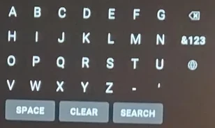 youtube tv app keyboard. four rows of characters in alphabetical order. there is a "clear" button between "space" and "search".