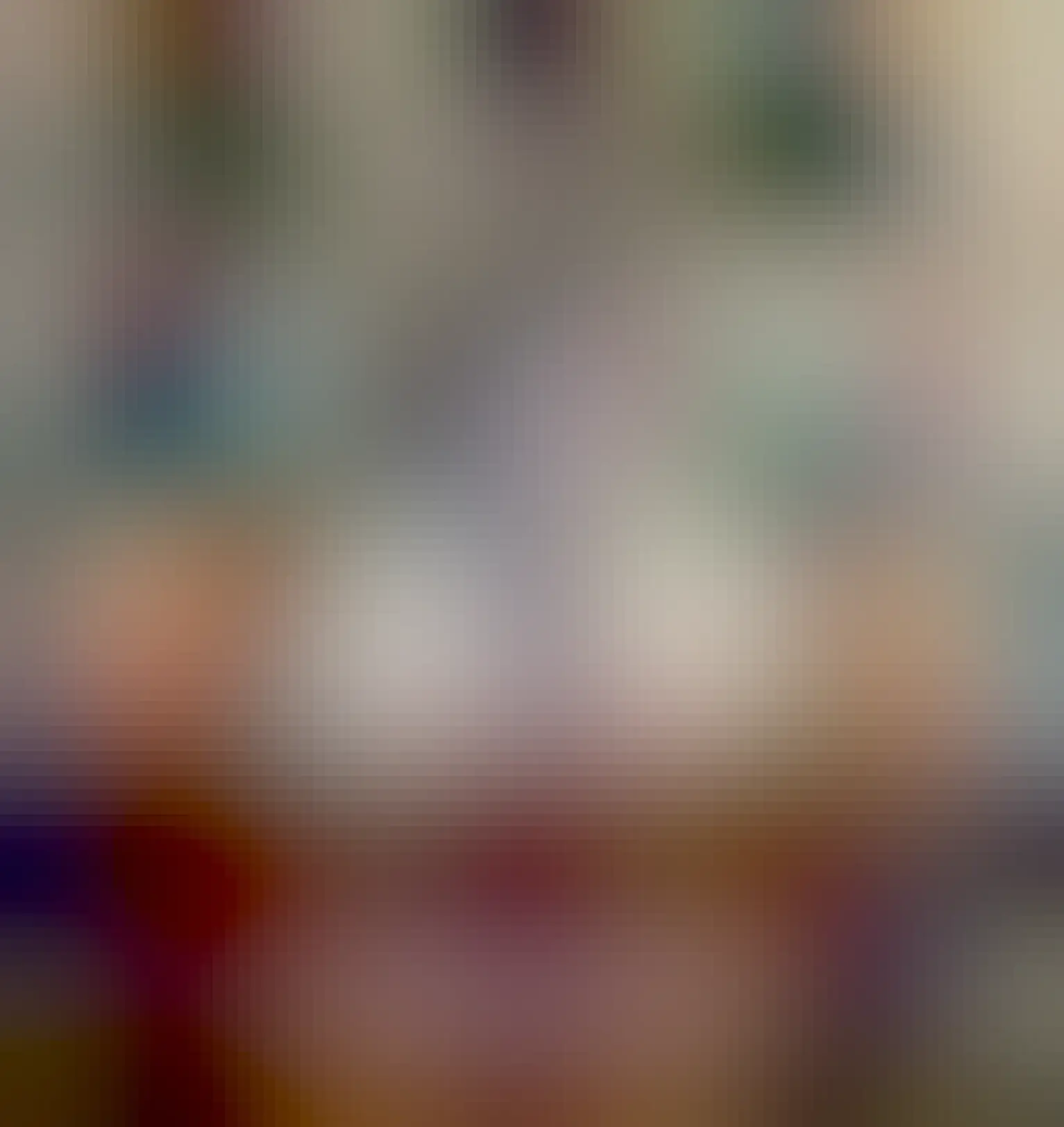 Shouty cat number two. A black and white cat sitting in a cat basket with its front paws resting on the edge, looking straight towards the camera.