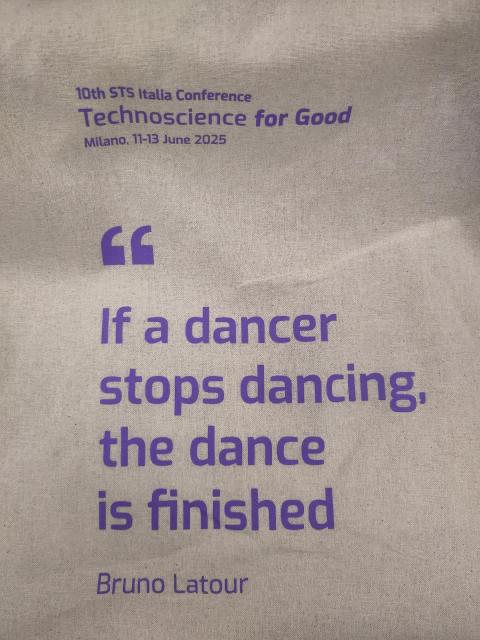 Tote bag for STSItalia conference with quote from Bruno Latour: "If a dancer stops dancing, the dance is finished." Purple letters on natural cotton.