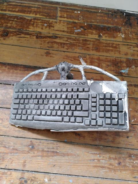 a sand-cast aluminium computer keyboard