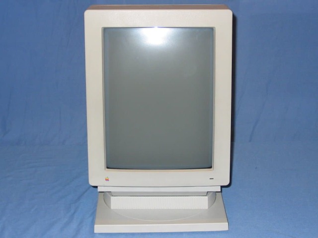 macintosh portrait display. a bulky beige CRT in portrait orientation