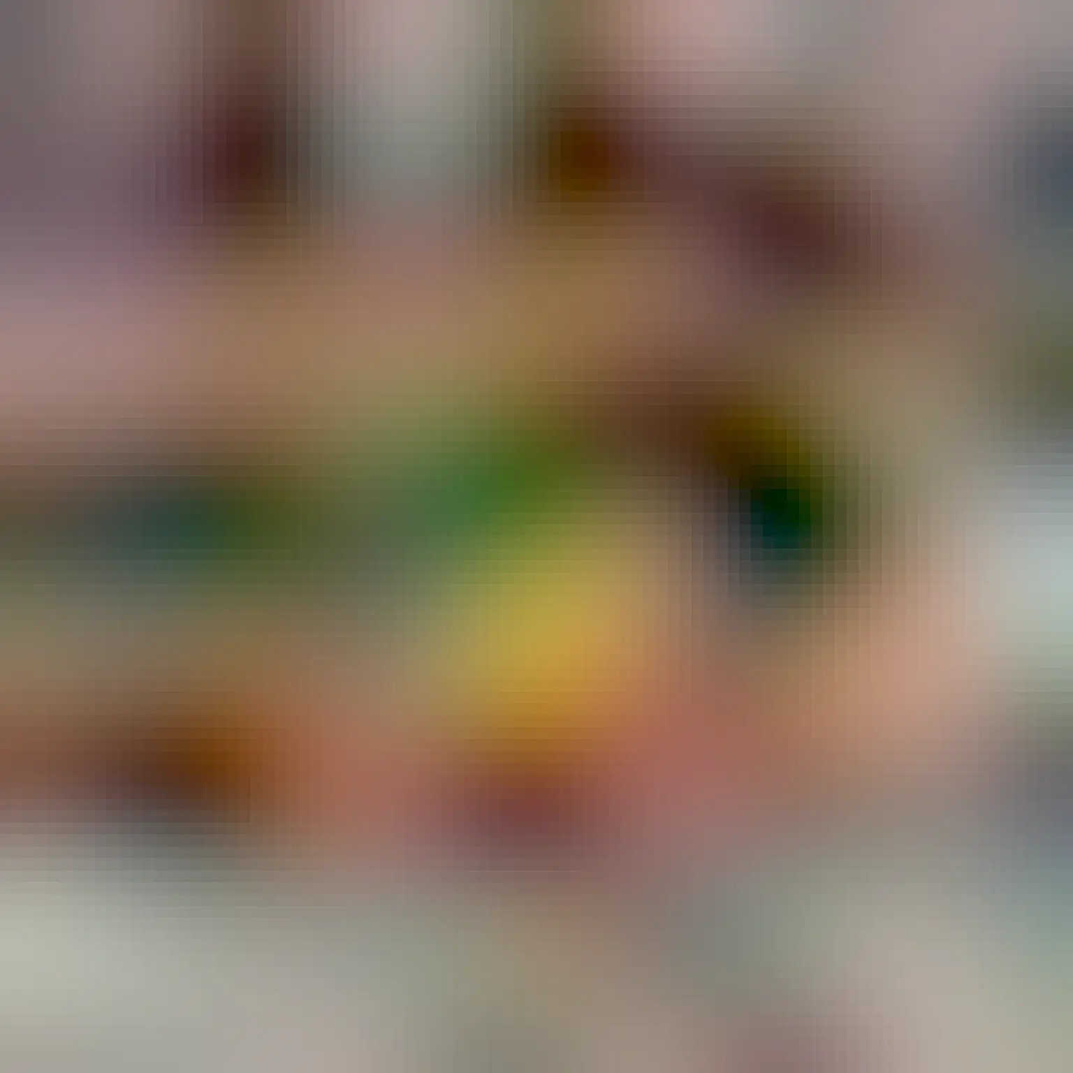 A photo of a small green cheek conure sleeping snuggled into my left hand. Bits of my pants and an iPad screen are visible in the background.