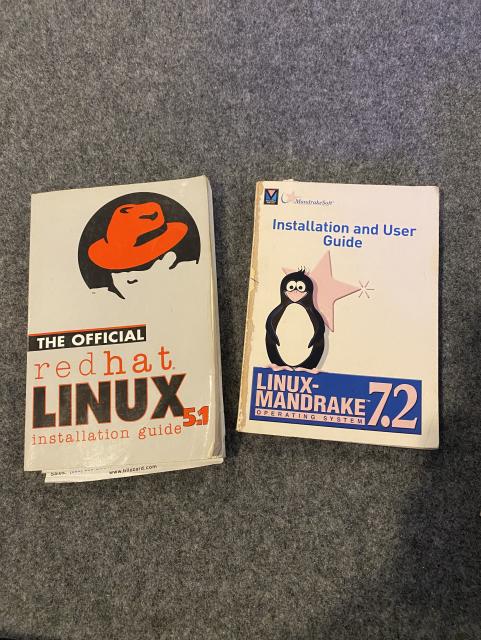 Two computer manuals side-by-side: "the official redhat linux 5.1 installation guide" and "installation and user guide" for "linux-mandrake 7.2"