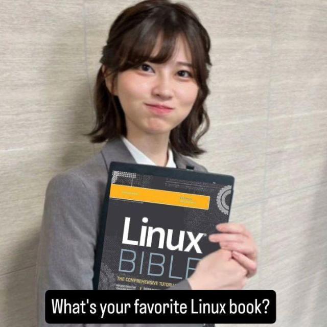 A happy-looking woman is seen holding a book called Linux Bible.

This is also written below:

What's your favorite Linux book?