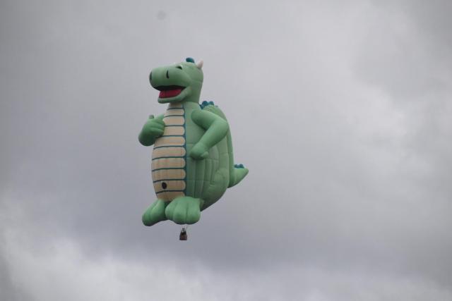 A jaunty green dinosaur hot air balloon