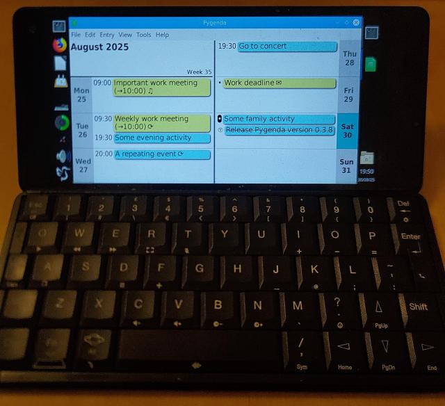A photo of a Gemini PDA - a clamshell palmtop computer with a keyboard similar to a Psion Series 5, bit with a colour screen. The Gemini is running Pygenda under Linux. Pygenda is in Week View, with a layout like a traditional paper diary. Various events are shown and are highlighted in yellow (for work entries) or blue (for personal entries).