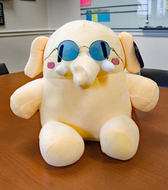 Plushtodon, wearing blue-tinted glasses