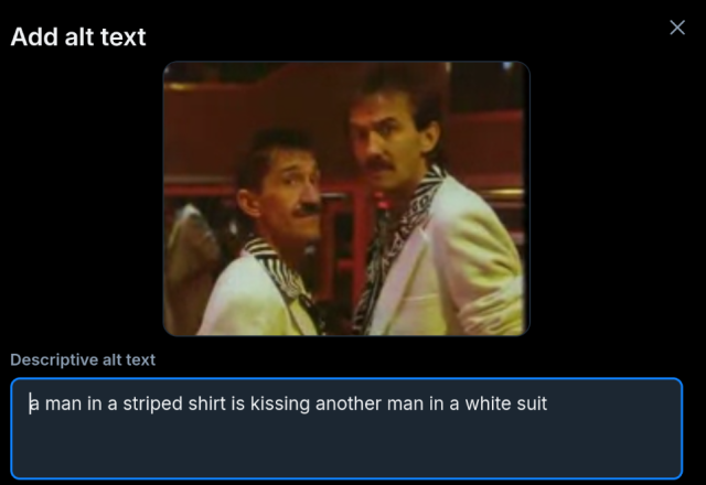 The Chuckle Brothers looking at each other. The default alt text is "a man in a striped shirt is kissing another man in a white suit".