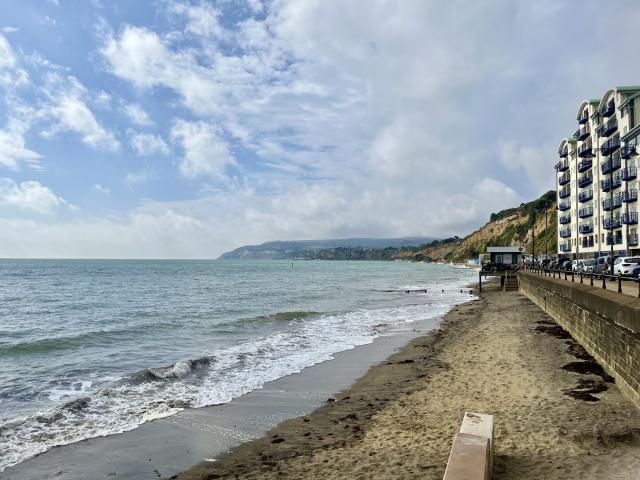 Sandown beach at high tide looking south