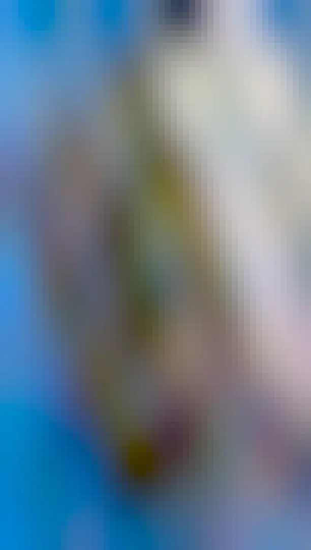 A white box with ribbed sides and a long antenna sticking out the bottom. It has a barcode with the label "LG-840266F2" on it, and it's placed high up on a telephone pole.