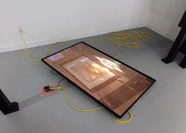 "The Objective Difference Between Use and Consumption" is a new video installation that presents a ~1000 frame-per-second slideshow of every photo in my personal digital photo library, dating from 2001 until June 2025. The video is presented as a loop (4:57) on a large lcd tv lying slightly-propped-up on the ground. It is surrounded by yellow hdmi and extension cable, and next to it sits a small single-board-computer atop a square of pink anti-static bubble wrap. A general-midi version of Green Day's "Good Riddance (Time of Your Life)" with an every-shifting tempo plays from the tv speaker.