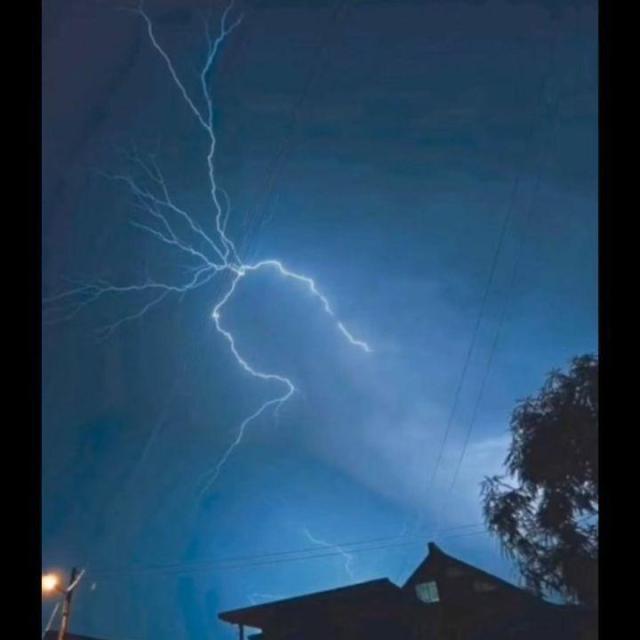 This is an edited photo of a sky in the nighttime; the lightning pattern in the sky shows the Kali Linux logo.