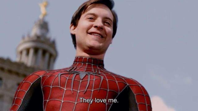 Tobey Maguire Spiderman smiling, looking down.
Caption: They love me.