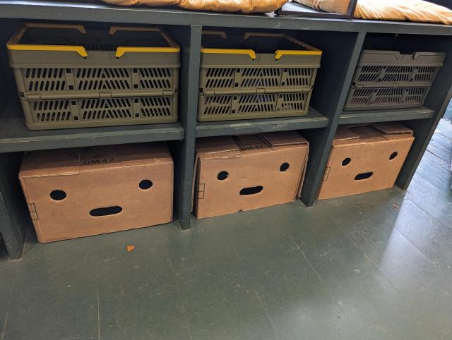 A row of boxes which all look delighted due to the holes looking like faces