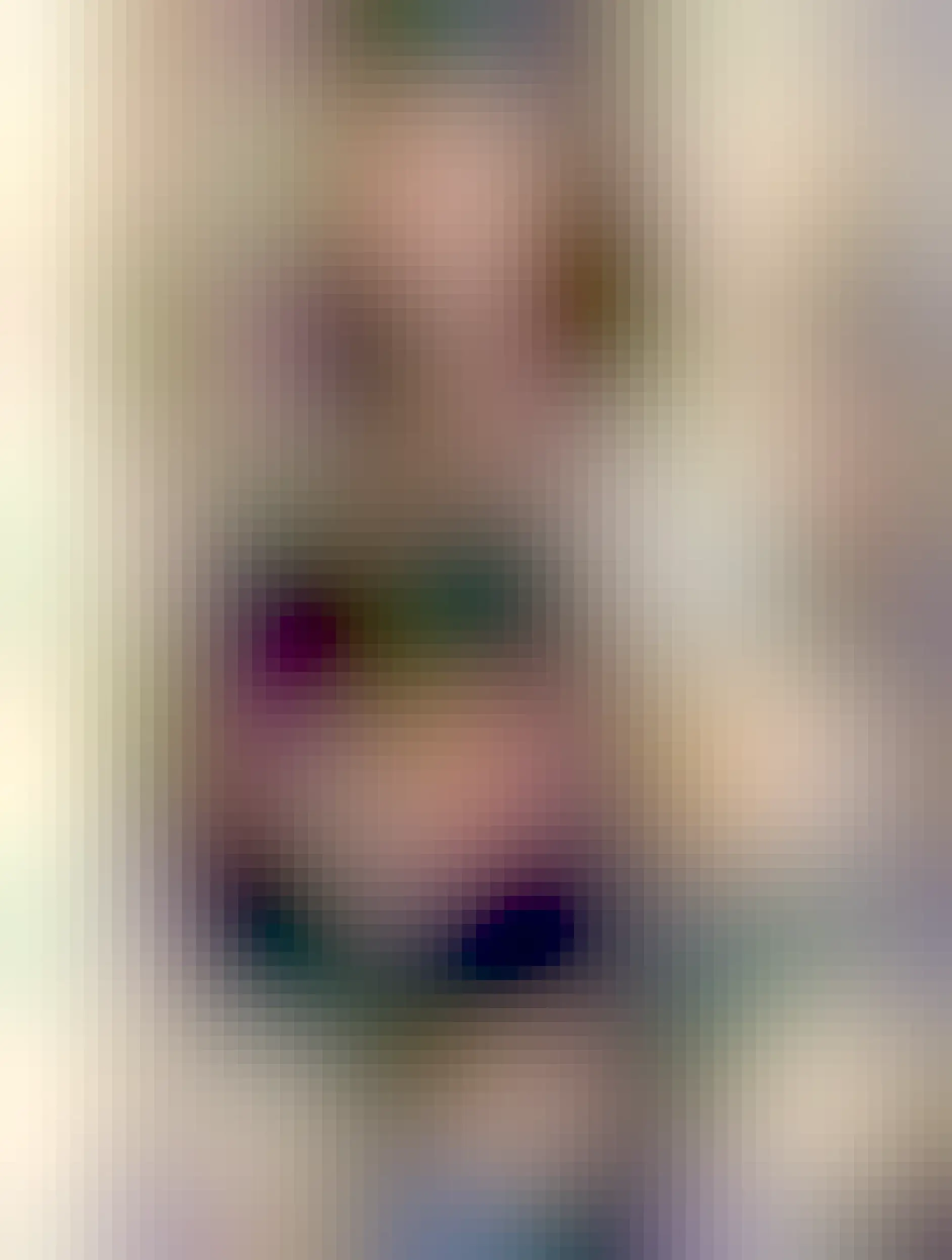 A lady (my wife!) with a black cat in her arms. Woman and cat are looking at each other. Kinda looks like a renaissance painting of Mary and the Infant Jesus, Especially because my wife has a blanket over her shoulders for some reason 