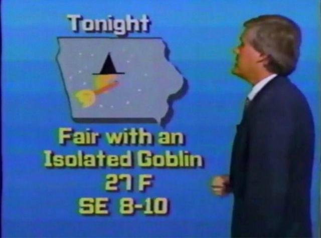 an old news image of a weatherman looking at a map of iowa featuring a sun wearing a witch's hat and broom. text reads: tonight:  fair with an isolated goblin. 27f, se 8-10